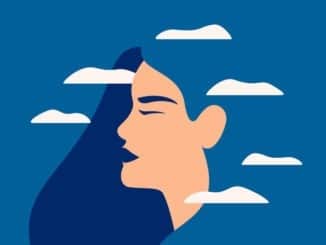 A sad young woman has a clouded mind on blue background.