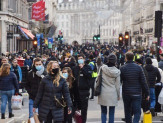 People with face masks on Regent Street, London