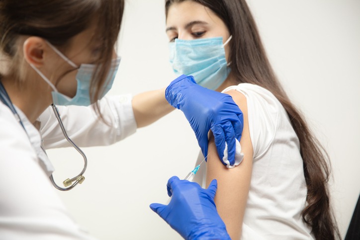 Teenager getting vaccine