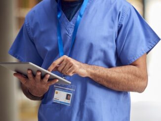 Nurse holding electronic tablet