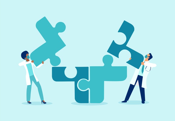 two doctors putting puzzle pieces together a symbol of team work and collaboration
