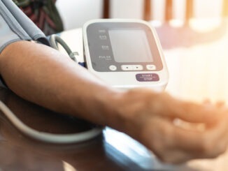 patient with blood pressure testing