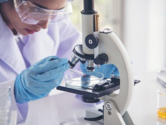 Woman scientist in lab look at science microscope medical test and research biology chemistry. Females technician laboratory analyzing scientific pharmacy genetic research. Chemistry Medical test lab