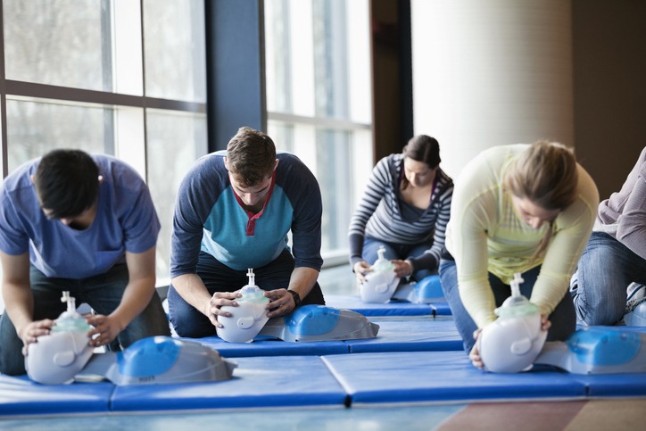 Group of people learning CPR