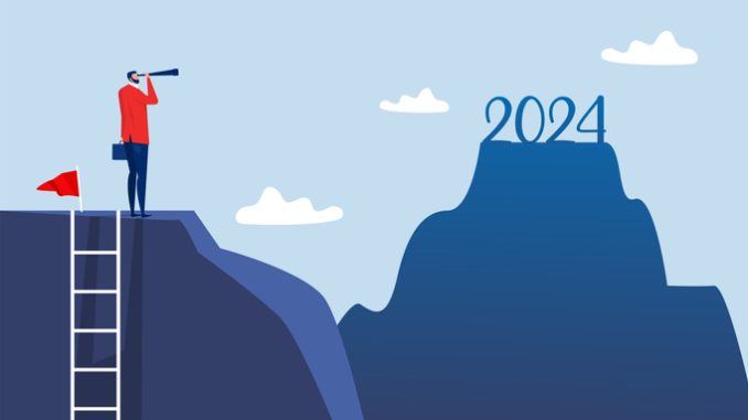 General practice manager looking ahead to 2024 through binoculars on top of the mountain