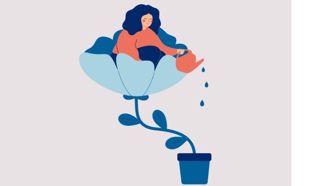 a happy woman sits in a flower pot and waters it and herself