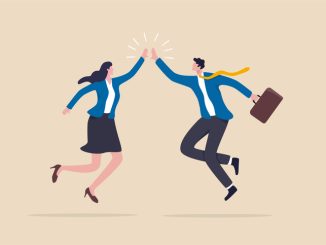 happy businessman and woman teamwork coworkers jumping and hi five clapping hands.