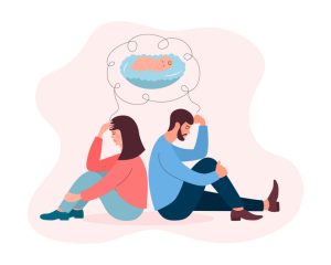 dreams about baby. Man and woman sitting back to back