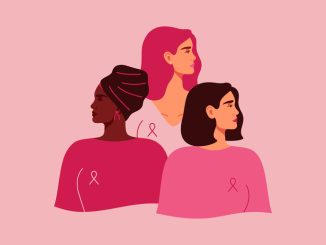 Three women with pink ribbons of different nationalities standing together.