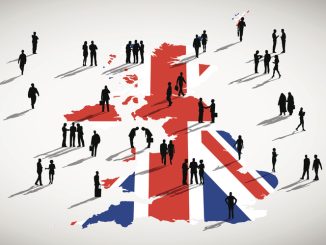 Silhouettes of business people on UK map