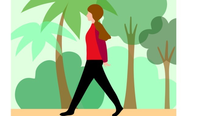 Woman taking a calm walk surrounded by nature