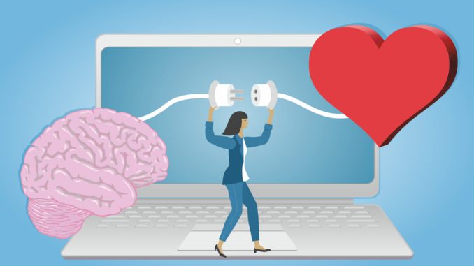 Computer with woman connecting brain and heart.