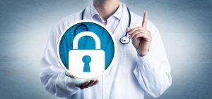 data security in health care by holding a locked padlock icon. Information technology and healthcare metaphor for cybersecurity, privacy, secure health records.