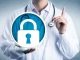 data security in health care by holding a locked padlock icon. Information technology and healthcare metaphor for cybersecurity, privacy, secure health records.