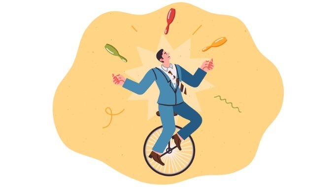 business man juggling on a unicycle