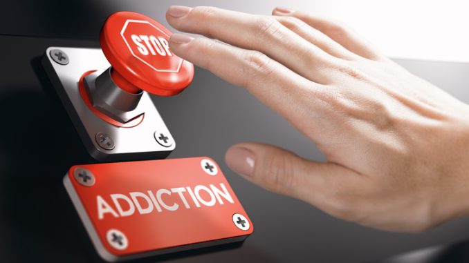 Woman pressing a panic button with stop sign to overcome gambling addiction 