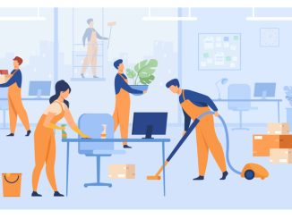 Professional janitors working in office