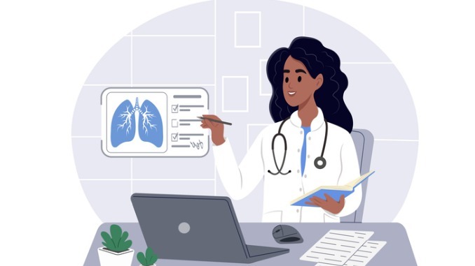 A doctor looks at a lung scan on a virtual screen while sitting at a table in a hospital. Diagnosis and treatment of lung disease.