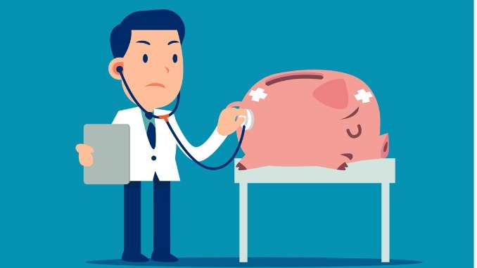 Doctor and sick piggy bank