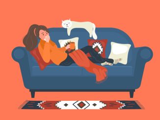 Flu. Ill woman lays on sofa at home and blowing her nose.