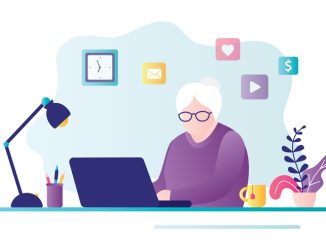 Old business woman works on computer