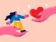 Woman and heart in hands showing support