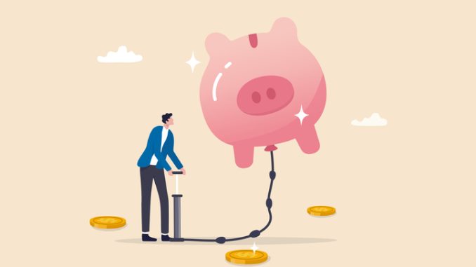 Saving or investment growth, money or financial deposit, wealth building, revenue increase or income, earning or profit, rich and prosperity concept, businessman inflate piggy bank to be bigger.