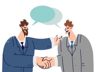 Handshakes of two white collar workers with dialogue clouds entering into partnership agreement