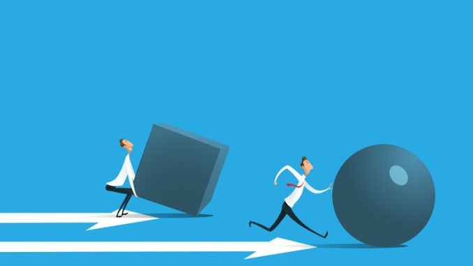 Businessman pushing sphere and leading the race against group other not so lucky guy pushing boxes. 