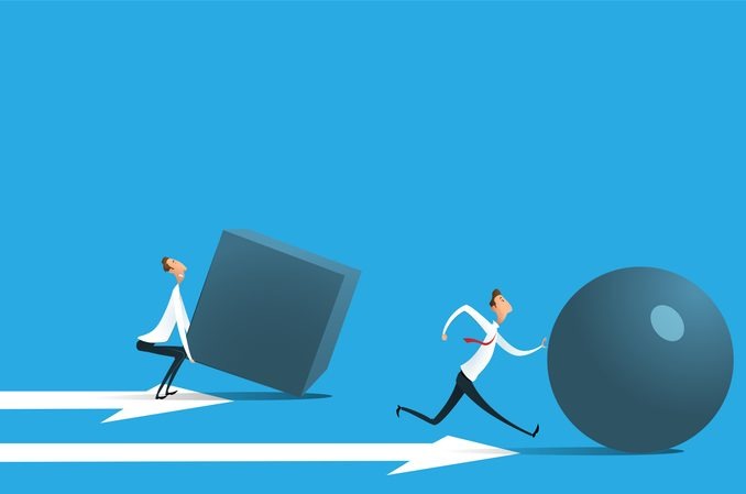 Businessman pushing sphere and leading the race against group other not so lucky guy pushing boxes.