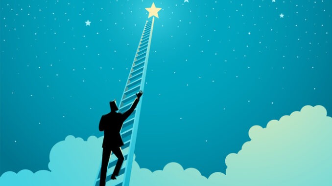 Person climbing a ladder to reach out for the stars