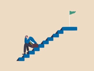 Lonely at the Top? Rethinking Leadership Connection depressed businessman sitting alone on stairway to success goal.