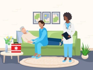 Paramedics provide medical care to an elderly patient at home