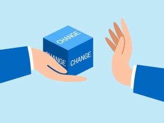 businessman hand refuse to open change cube box representing fear of leaving status quo or comfort zone