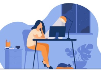 Woman working at night in home office