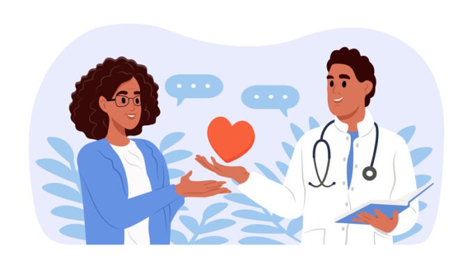 Young smiling doctor holding a heart. A doctor gives support and care to an elderly woman