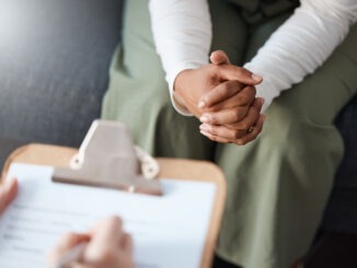 Cropped shot of an unrecognisable woman sitting with her psychologist during a consultation