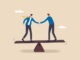 Negotiation for business winning, agreement or partnership deal for both benefit, merger and acquisition, professional talk concept, businessman handshake with success negotiation over balance seesaw.