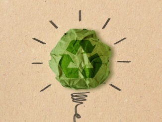 Light bulb drawing with recycling sign on crumpled recycled paper - Concept of ecology and recycling