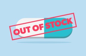 Out of stock medication. Drug shortage. Blue pill with red text stamp.