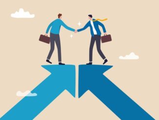 Cooperation partnership, work together for success, team collaboration, agreement or negotiation, collaborate concept, businessmen handshake on growth arrow joining connection agree to work together.