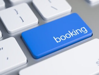 A Keyboard with a Blue Keypad - Booking. High Quality Render of a Aluminum Keyboard Keypad. The Key is Blue in Color and there is Message Booking on It. 3D Illustration.