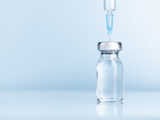 Close-up of syringe and injection vial efficient for flu, coronavirus, Covid-19 vaccine disease