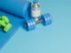 3D rendered workout equipment for training at home on blue background, Top view.